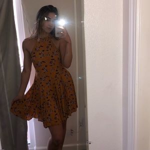 yellow high neck dress with purple flowers